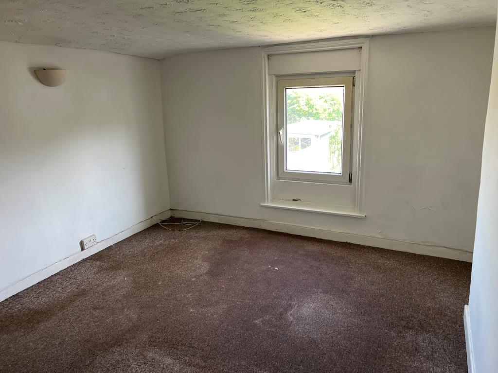 Lot: 102 - FOUR-BEDROOM TOWN CENTRE HOUSE FOR IMPROVEMENT - The Bedroom in the Potential Annexe